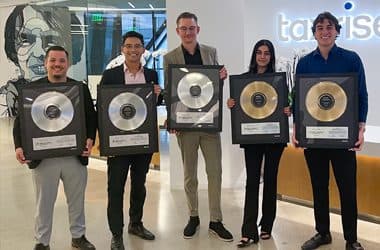TaxRise employees present awards