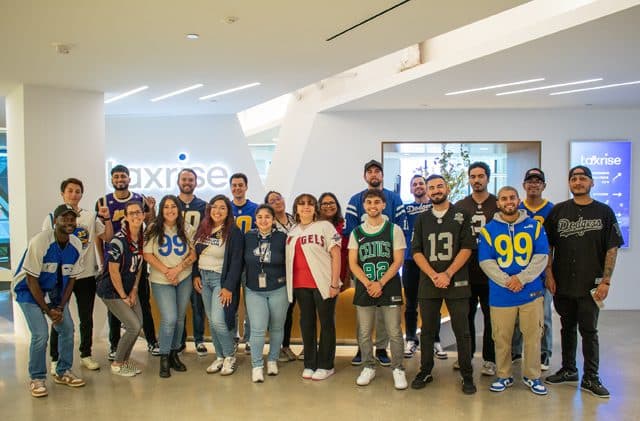 TaxRise employees represent their favorite sports teams