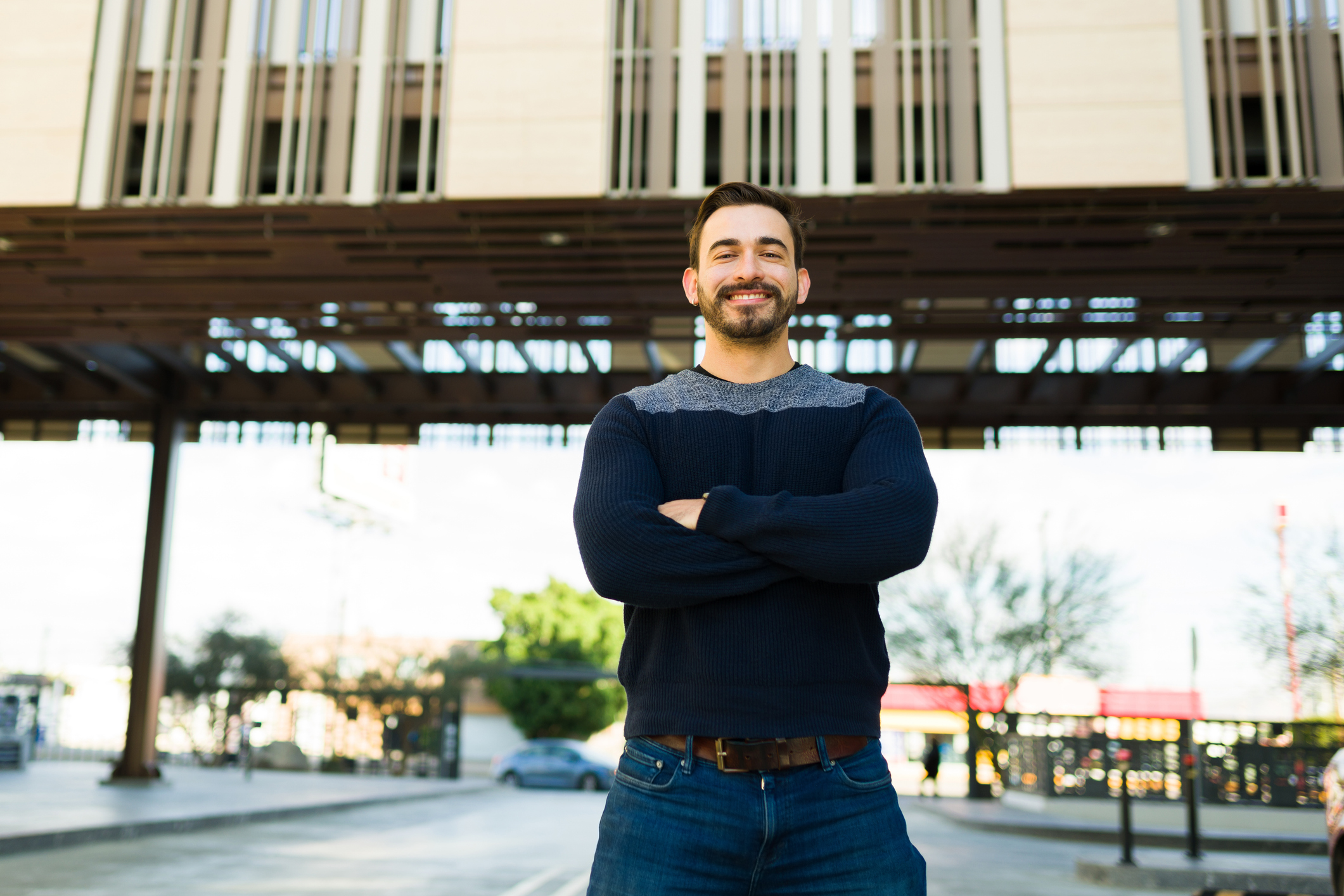 Portrait of a smiling young man in the city