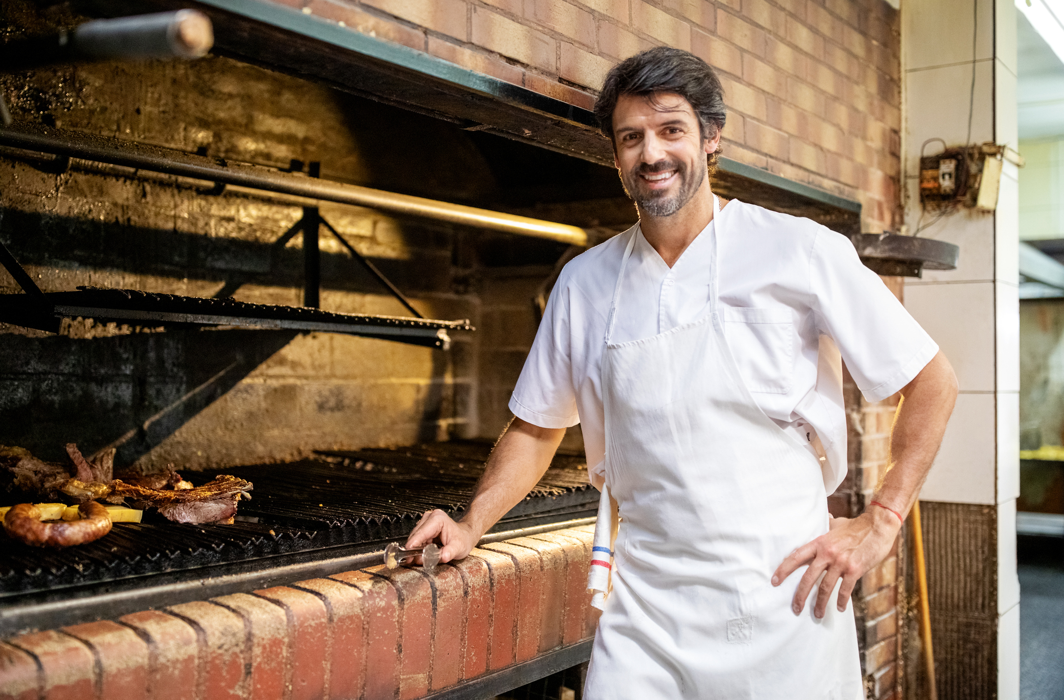 Happy male chef working in a restaurant kitchen