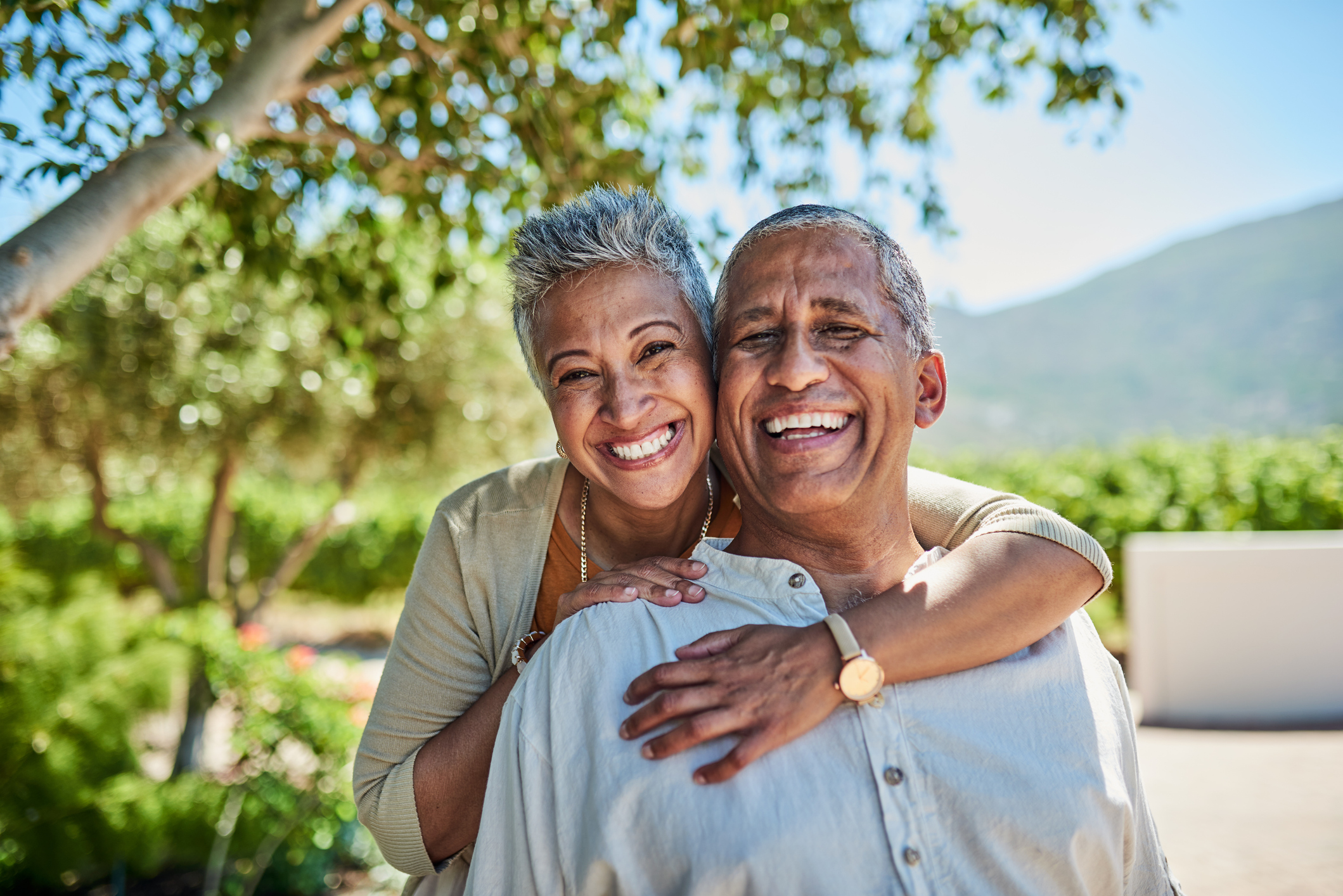 Happy senior retired couple smiling outdoors