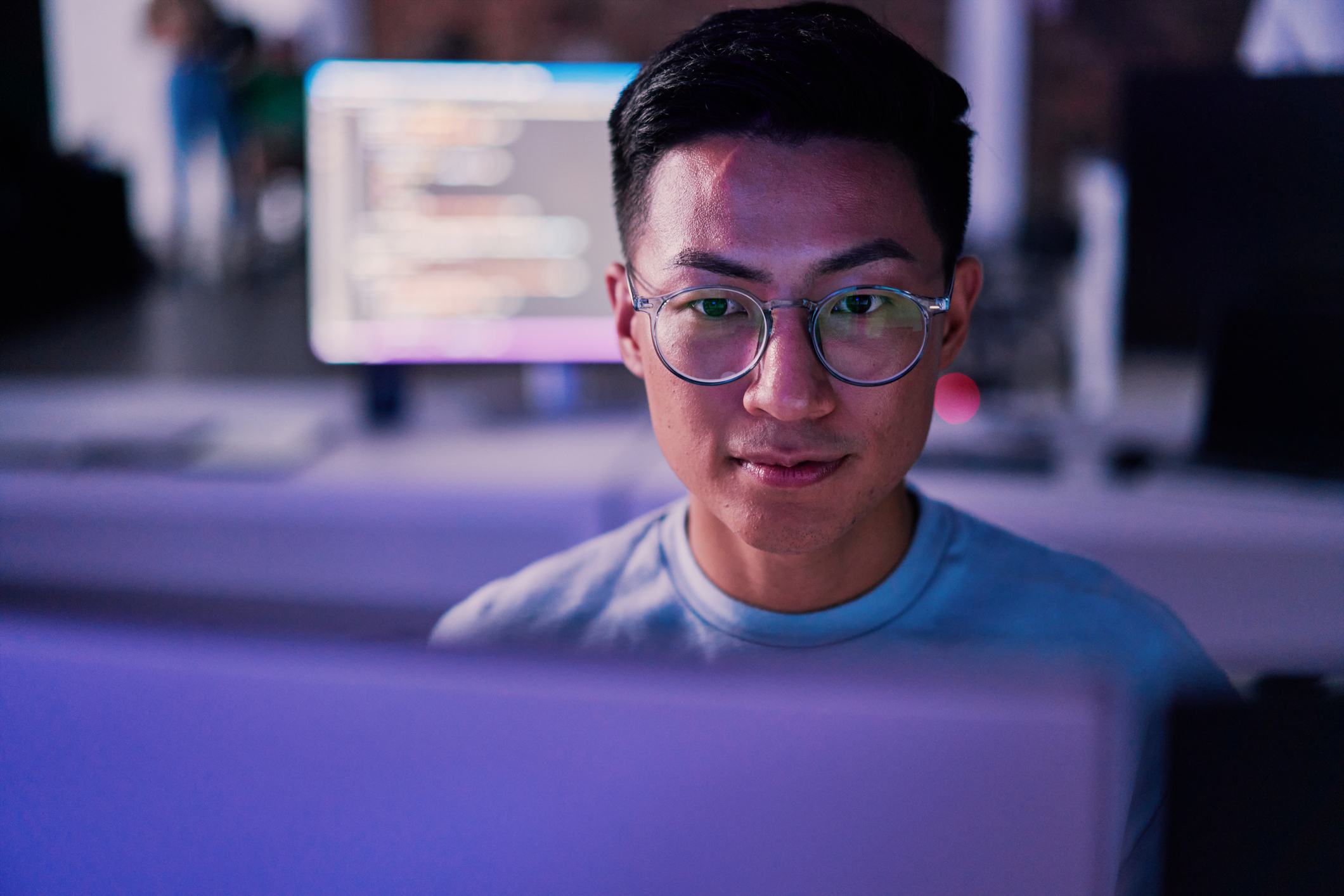 Young man works on computer